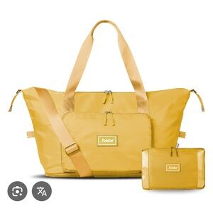 New, never opened yellow Foldie. In packaging.